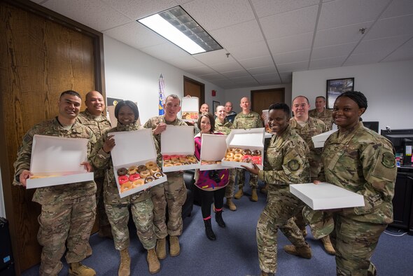 First sergeants from the 27th Special Operations Wing pose with donuts for the inaugural Diamonds and Donuts event at Cannon Air Force Base, N.M., March 22, 2019. The first sergeants hand-delivered the donuts to 27th Special Operations Force Support Squadron Air Commandos. (U.S. Air Force photo by Airman 1st Class Vernon R. Walter III)