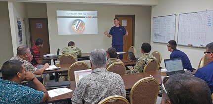190320-N-NB178-1067 MAJURO, Republic of the Marshall Islands (March 20, 2019) U.S. Coast Guard Lt. Cmdr. Kevin Cooper speaks at a search and rescue planning meeting led by Coast Guardsmen from the U.S. Coast Guard 14th District during Pacific Partnership 2019. Pacific Partnership, now in its 14th iteration, is the largest annual multinational humanitarian assistance and disaster relief preparedness mission conducted in the Indo-Pacific. Each year, the mission team works collectively with host and partner nations to enhance regional interoperability and disaster response capabilities, increase stability and security in the region, and foster new and enduring friendships in the Indo-Pacific. (U.S. Navy photo by Mass Communication Specialist 1st Class Tyrell K. Morris)