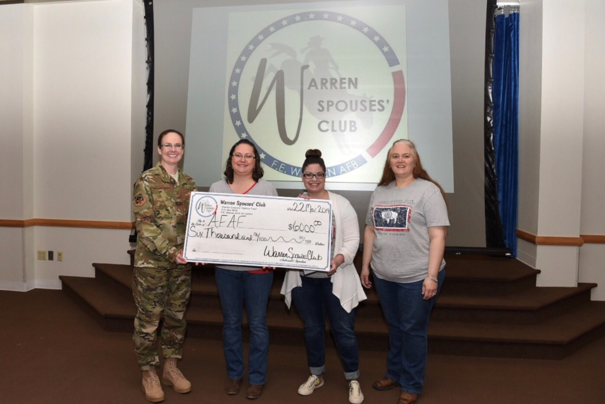 Colonel Stacy Jo Huser, 90th Missile Wing Commander and Chief Master Sgt. Gemma Clark, 90th Missile Wing interim command chief, fill out donation cards after the Air Force Assistance Fund kickoff breakfast March 22, 2019, at the Trail’s End Event Center on F.E. Warren Air Force Base, Wyo. The campaign, themed "Commitment to Caring," runs until May 3, 2019 with a goal of more than $40k. (U.S. Air Force photo by Airman 1st Class Braydon Williams)