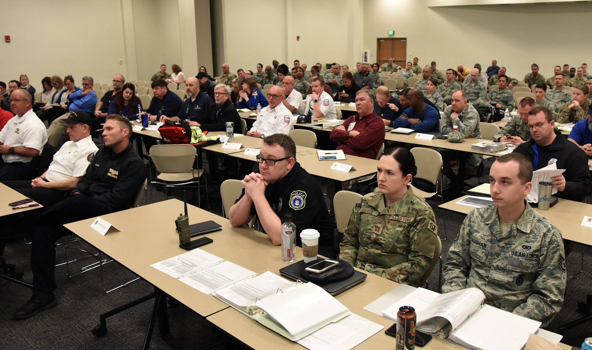 Members of the Keesler Crisis Action Team and first responders from both Keesler and the local communities attend a joint table top exercise inside the Roberts Consolidated Aircraft Maintenance Facility at Keesler Air Force Base, Mississippi, March 21, 2019. The event, which was in preparation for the upcoming major accident response exercise in April, allowed attendees to review and discuss tactical and strategic planning in the case of a crisis situation. (U.S. Air Force photo by Kemberly Groue)