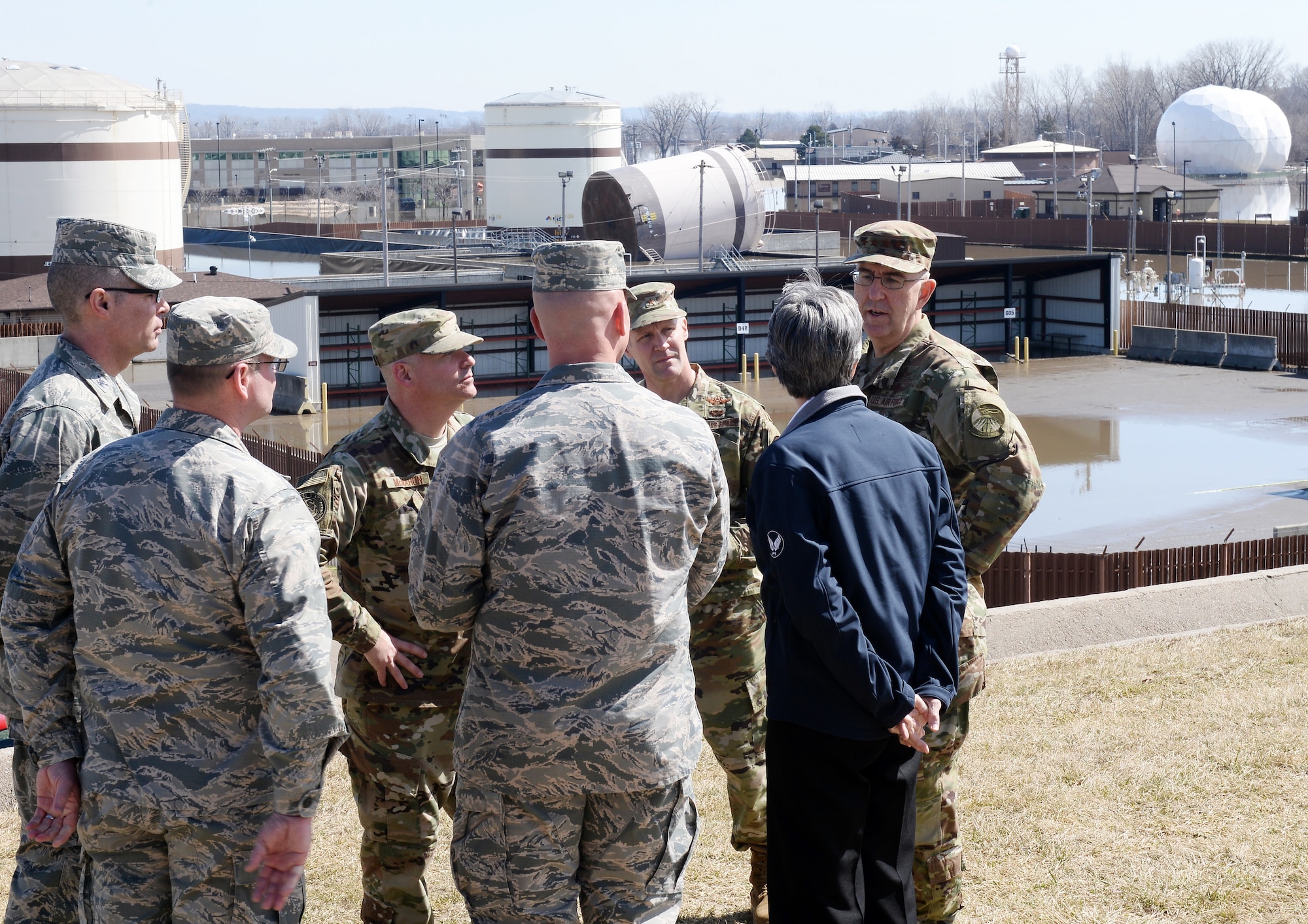 U.S. Strategic Command Commander Gen. John Hyten talks with Secretary of the Air Force Heather Wilson March 22, 2019, on Offutt Air Force Base, Neb. A week earlier the base began taking on flood waters that eventually covered one-third of the installation. (U.S. Air Force photo by Charles Haymond)