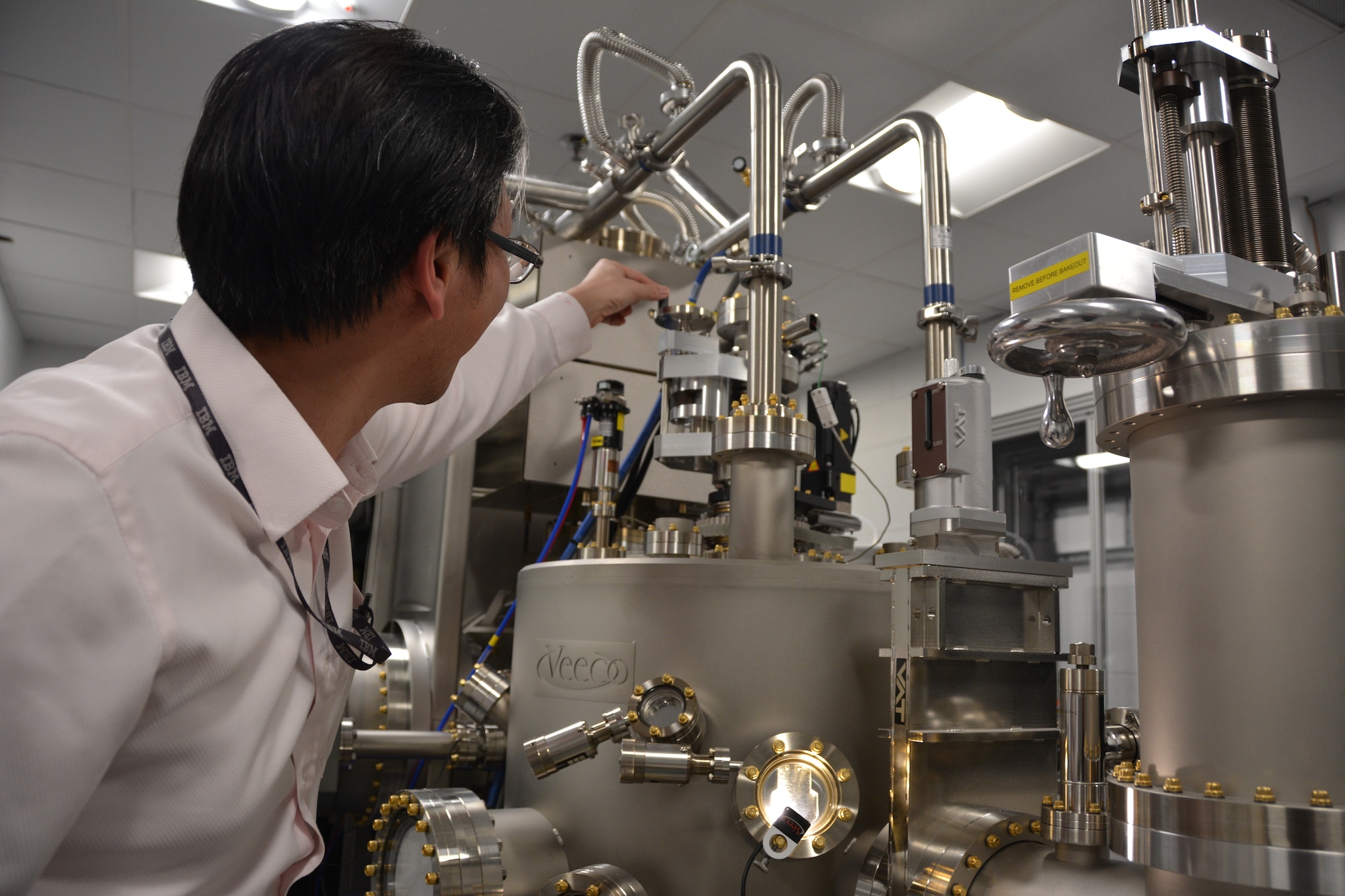 AFRL Materials Researcher Dr. Shin Mou shows off the laboratory’s new Molecular Beam Epitaxy chamber, a highly-specialized piece of equipment enabling the growth of semiconducting materials for a new breed of lighter, smaller, more agile electronics. (U.S. Air Force Photo/Adrienne Kreighbaum)