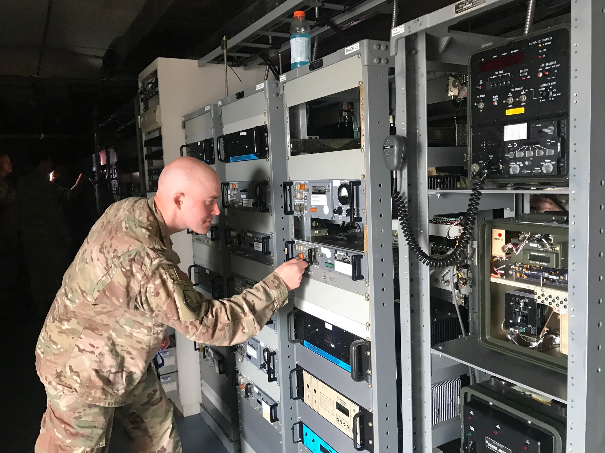 U.S. Air Force Master Sgt. Mark Melchert, 210th Engineering Installation Squadron, checks the status of a damage radio at Tyndall Air Force Base, Nov. 5, 2018.