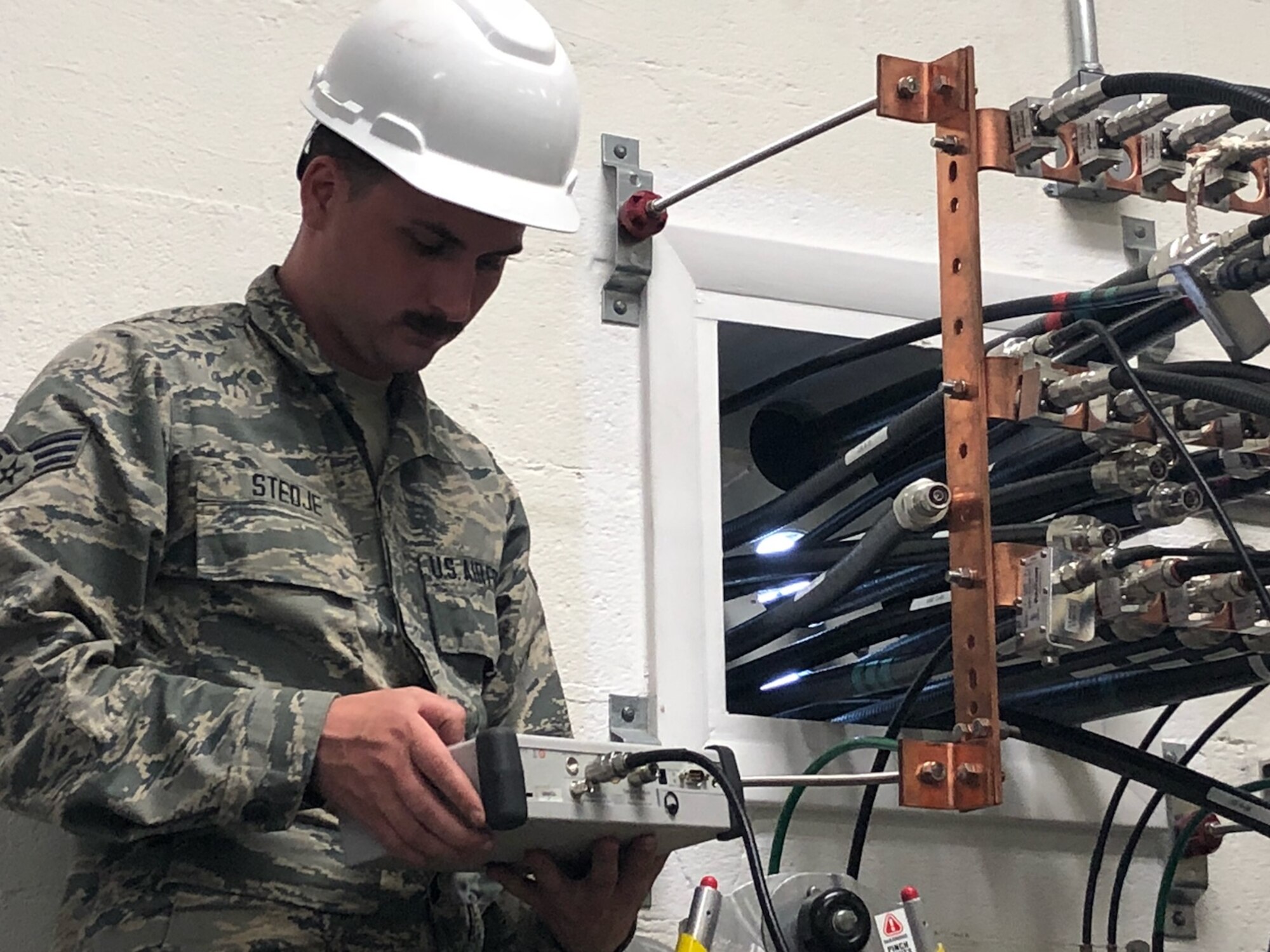 U.S. Air Force Senior Airman Shane Stedje, 210th Engineering Installation Squadron, tests a voltage standing wave ratio at Tyndall Air Force Base, Nov. 30, 2018.