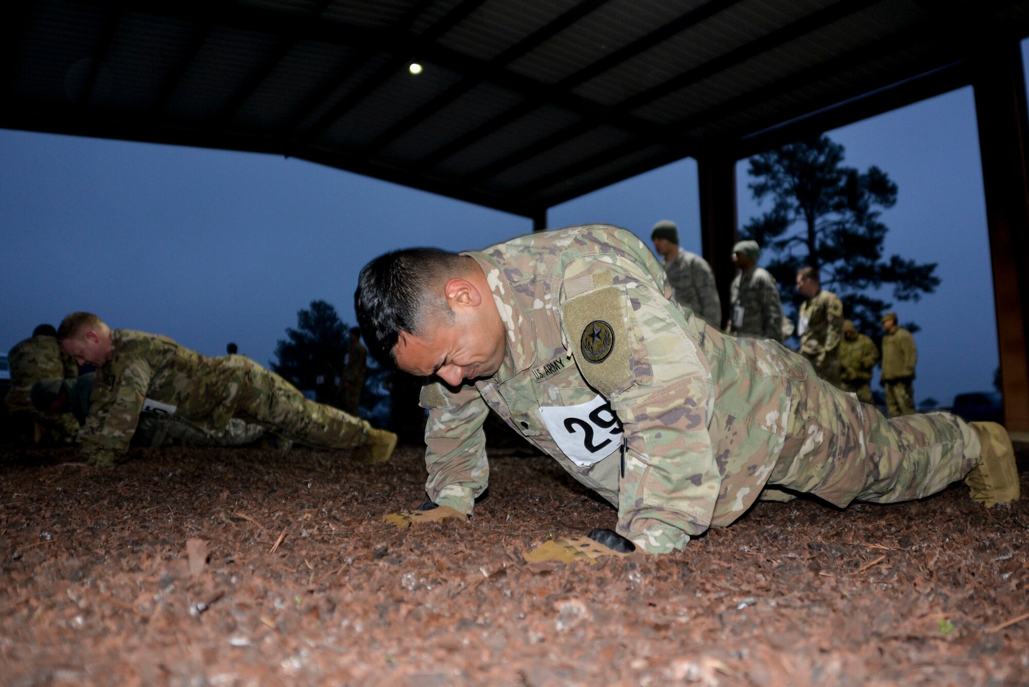 Spc. Miguel Ruiz, 100th Mobile Public Affairs Detachment, 71st Troop Command, performs as many pushups possible during the physical fitness portion of the Texas National Guard’s Best Warrior Competition held at Camp Swift, Texas Feb. 28, 2019. The physical fitness assessment test the competitors on pushups, sit-ups and a four-mile run. (Texas Air National Guard photo by Senior Airman Bryan Swink)