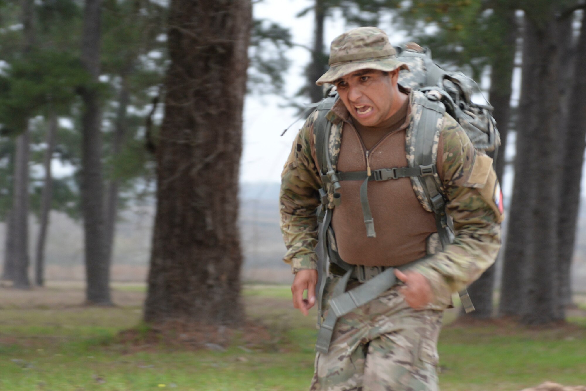 Sgt. Mayquel Garcia, Chilean Army, sprints to the finish line carrying a 35-pound ruck sack completing the 12-mile ruck march to begin day three of the Texas National Guard’s 2019 Best Warrior Competition at Camp Swift March 1, 2019. The four-day event not only features some of the state’s top Soldier and Airmen, but also features competitors from Chile and the Czech Republic, who are both partners of the Texas military under the State Partnership Program. (Texas Air National Guard photo by Senior Airman Bryan Swink)