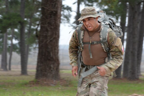 Spc. Juan Gonzalez, Texas Army National Guard, pushes himself to the finish line to complete the 12-mile ruck march wearing a 35-pound ruck sack during the Texas National Guard’s 2019 Best Warrior Competition at Camp Swift March 1, 2019. The competition is currently putting the competitors through demanding physical and mental tests which include a modified Army physical fitness test, an obstacle course, marksmanship drills, land navigation, formal board interviews, written exams, and a mystery event. (Texas Air National Guard photo by Senior Airman Bryan Swink)