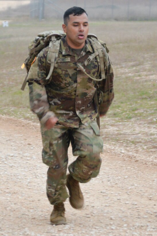 Competitors started on their 12-mile ruck march carrying a 35-pound ruck sack well before dawn on the third day of the Texas National Guard’s 2019 Best Warrior Competition at Camp Swift, Texas March 1, 2019.  They began the ruck march just a couple hours after completing a nighttime land navigation challenge. (Texas Air National Guard photo by Senior Airman Bryan Swink)