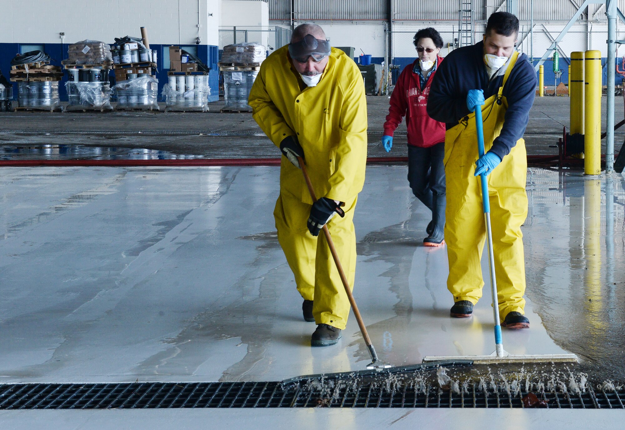 Team Offutt members clear debris from one of the docks at the Bennie L. Davis Maintenance Facility on March 21, 2019. Team Offutt personnel have regained access to buildings and facilities to begin assessing damage and recovering items which were underwater less than a week ago (Photo by Charles Haymond).
