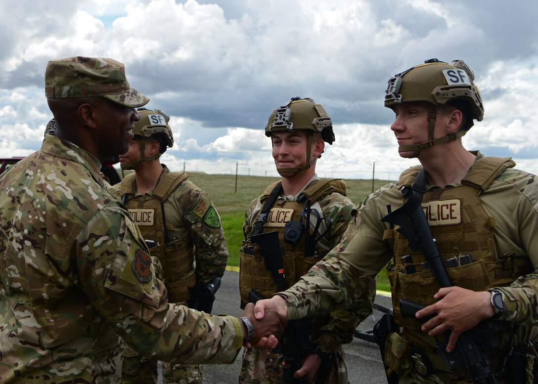 Chief Master Sgt. of the Air Force Kaleth O. Wright speaks with members of the 9th Security Forces Squadron during a base tour March 20, 2019, at Beale Air Force Base, California. The 9th SFS demonstrated a unique grappler system designed to disable cars in a high-speed chase. Wright visited multiple units and spoke with Airmen about fostering resilience and developing leaders. (U.S. Air Force by Senior Airman Tristan D. Viglianco)