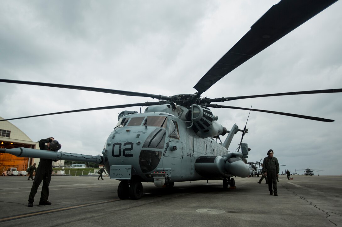 A U.S. Marine Corps CH-53 Super Stallion helicopter, assigned to Marine Heavy Helicopter Squadron 465, prepares for take-off from the flight line of Marine Corps Air Station Futenma, Okinawa, Japan, Mar. 7, 2019. This aircraft underwent a combined Planned Maintenance Interval (PMI) and H-53 Reset event at Fleet Readiness Center Western Pacific. Combining the CH-53E PMI and reset events greatly reduces the amount of time a CH-53E spends out of service allowing the aircraft to be available for operational commitments. (U.S. Marine Corps photo by Pfc. Ethan LeBlanc)