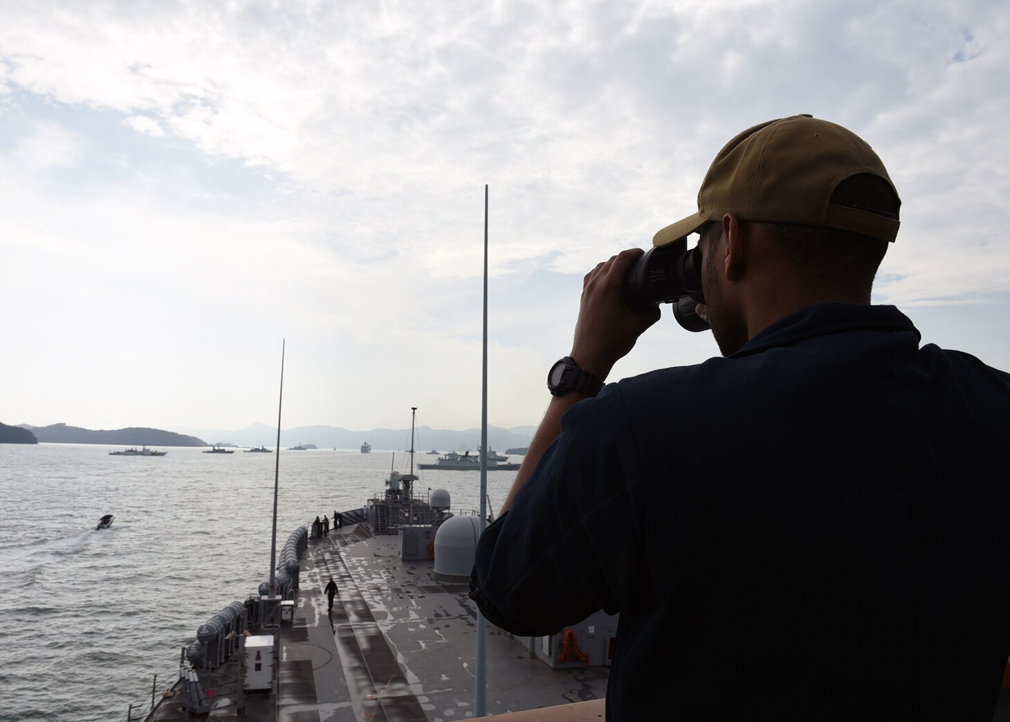 STRAIT OF MALACCA (March 25, 2019) - Quartermaster 3rd Class Felix A. Tejada, from Bronx, N.Y., performs his duties as a lookout aboard U.S. 7th Fleet Flagship USS Blue Ridge (LCC 19) as the ship arrives for a port visit to Langkawi, Malaysia. Blue Ridge is the oldest operational ship in the Navy, and as 7th Fleet command ship, is responsible for fostering relationships within the Indo-Pacific Region.