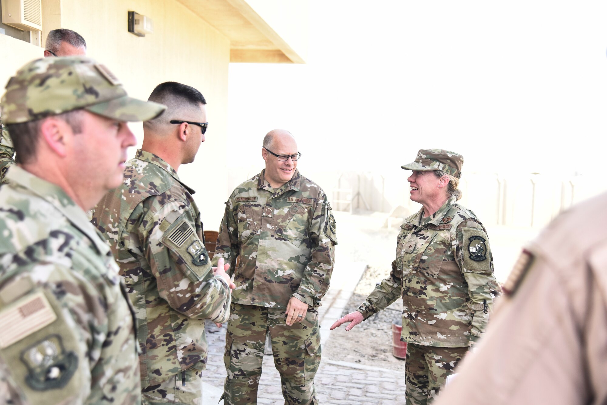 727th Expeditionary Air Control Squadron Airmen, deployed from the Utah Air National Guard, speak to Brig. Gen. Christine Burckle, UTANG commander, at Al Dhafra Air Base, United Arab Emirates, Mar. 14, 2019. Burckle, who became the first woman to command UTANG in 2016, tagged along with other UTANG leadership to visit the currently deployed UTANG Airmen. (U.S. Air Force photo by Senior Airman Mya M. Crosby)