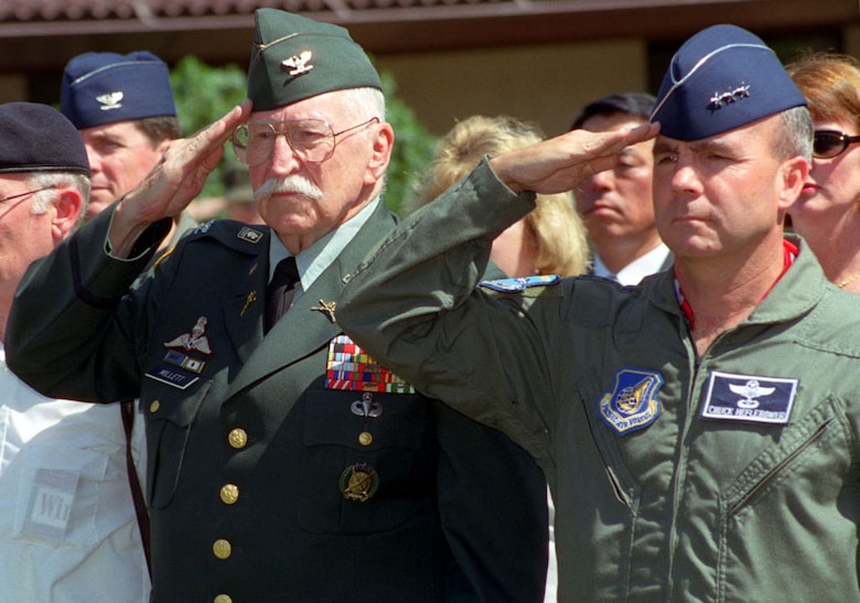 Col. Lewis Millett and Lt. Gen. Charles Heflebower, prior 7th Air Force commander, salute during a Hill 180 ceremony in February 2000. Team Osan pays tribute to the soldiers of the 27th Infantry Regiment annually, whose heroic actions helped secure the freedom of South Koreans during the Korean War in 1951. Millett received the Medal of Honor after the battle. (Courtesy photo)