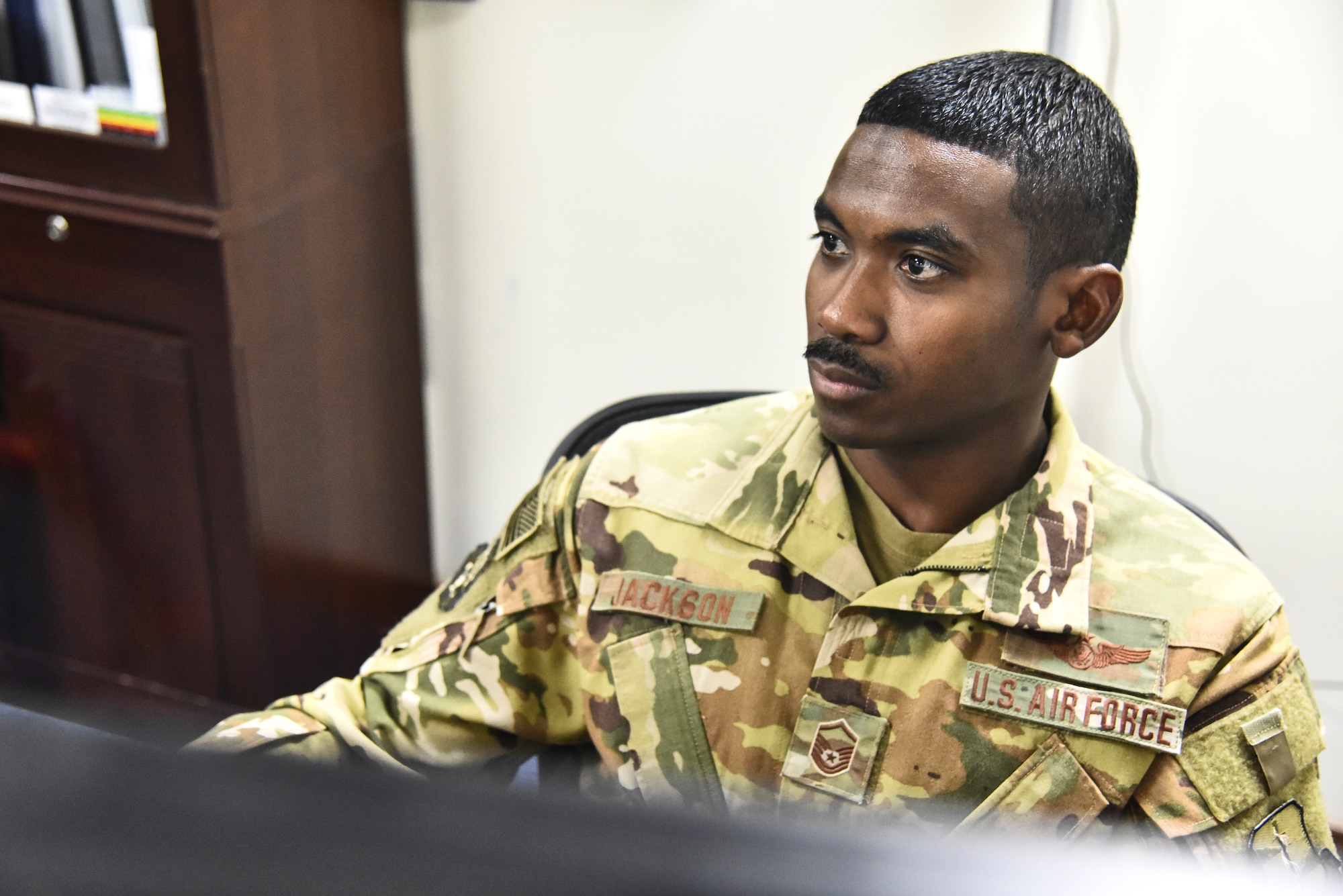 Master Sgt. William Jackson, 380th Air Expeditionary Wing Plans and Programs superintendent, reviews programs at Al Dhafra Air Base, United Arab Emirates, Mar. 18, 2019. The 380th AEW Plans and Programs shop, also known as XP, is responsible for developing base’s plans, programs and policies; coordinating programming actions to resolve issues; and constantly analyzing the effectiveness of these programs. (U.S. Air Force photo by Senior Airman Mya M. Crosby)