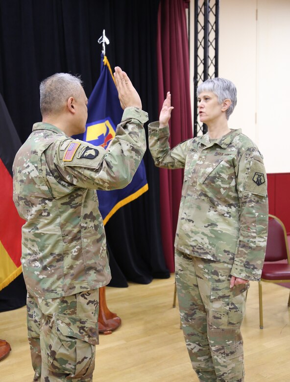 Col. Alex Wells, deputy commander of the 7th Mission Support Command, administers the Warrant Officer Oath of Office to Chief Warrant Officer Five Vikki Hecht, as she assumed the role of Command Chief Warrant Officer of the 7th MSC during a ceremony March 23 at the Kaiserslautern Community Activity Center, Germany.