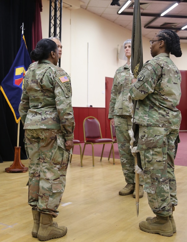 Chief Warrant Officer Five Martha Ervin relinquished responsibility to Chief Warrant Officer Five Vikki Hecht by the symbolic passing of the Warrant Officer Guidon during the Change of Responsibility ceremony March 23 at the Kaiserslautern Community Activity Center, Germany.