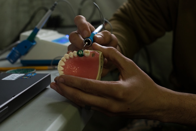 Hospital Corpsman 3rd Class Thomas Wesley, a dental lab technician with 2nd Dental Battalion creates a temporary prosthetic tooth during an Authorized Dental Allowance List exercise at Camp Lejeune, N.C., March 19, 2019. The exercise was a three-week course designed to provide dental care in a field environment, while enhancing the dental readiness of II Marine Expeditionary Force personnel. (U.S. Marine Corps photo by Cpl. Ashley Lawson)