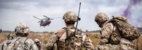 Technical Sgt. Matthew Spittler, right, and Senior Airman Tyler Trocano, center, await extraction with Sgt. 1st Class Steven Sparks from 2nd platton, Charlie troop, Team 2-2, 1-126 Cavalry Regiment, Michigan National Guard, Dowagiac, Mich. on a CH-47 Chinook Helicopter from the Illinois Army National Guard 2nd Battalion, 238th General Support Aviation Battalion, Peoria, Ill. during Operation Northern Strike 2014 near Grayling, Mich. on Aug. 11, 2014. Both Airmen are Joint Terminal Air Controllers from the 148th Air Support Operations Squadron, Fort Indiantown Gap, Pa. Operation Northern Strike 2014 is a joint multi-national combined arms training exercise conducted in Michigan. (U.S. Air National Guard photo by Master Sgt. Scott Thompson/released)