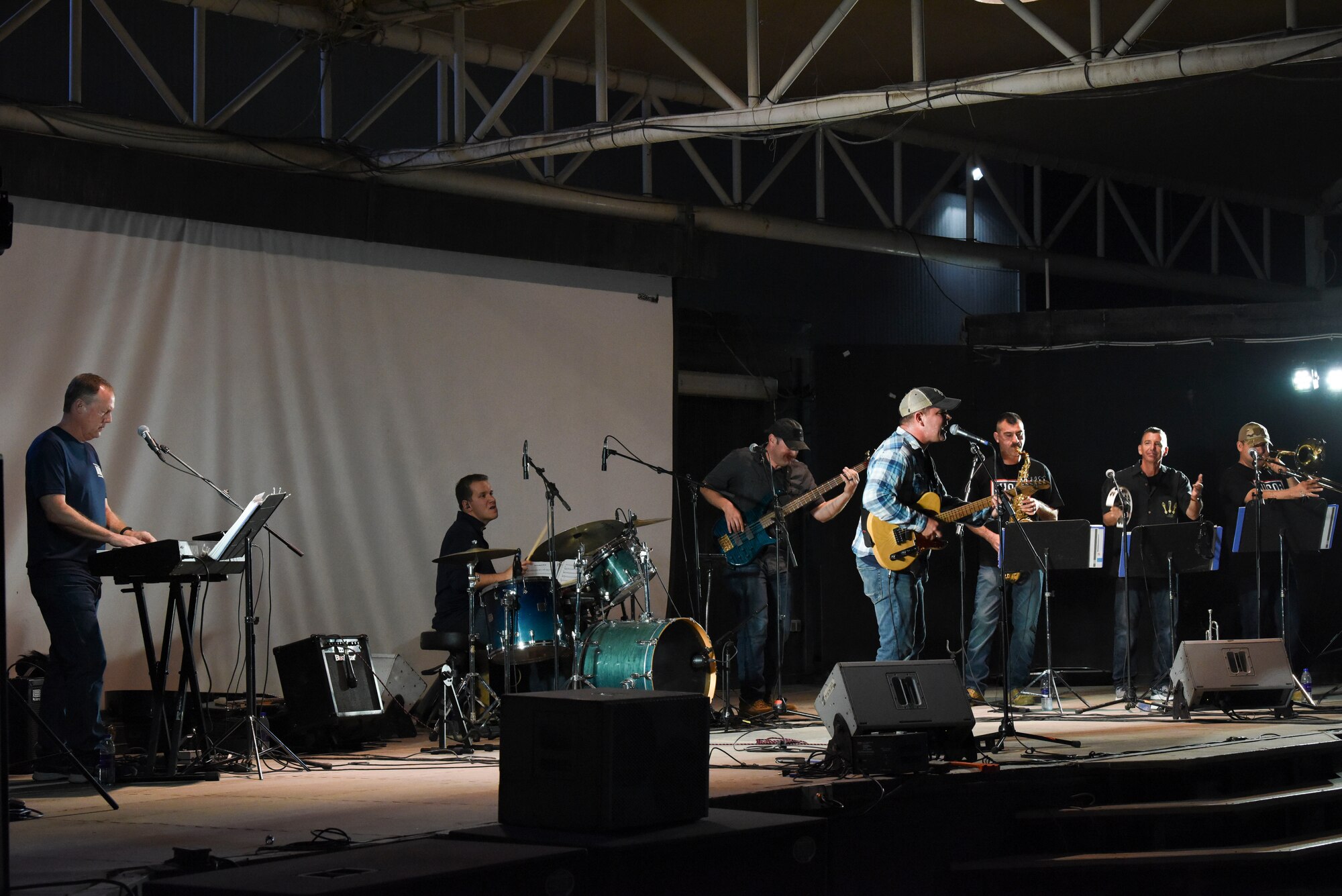 The Air Forces Central Command band performs a song for the crowd of deployed members at Al Dhafra Air Base, United Arab Emirates, Mar. 20, 2019.