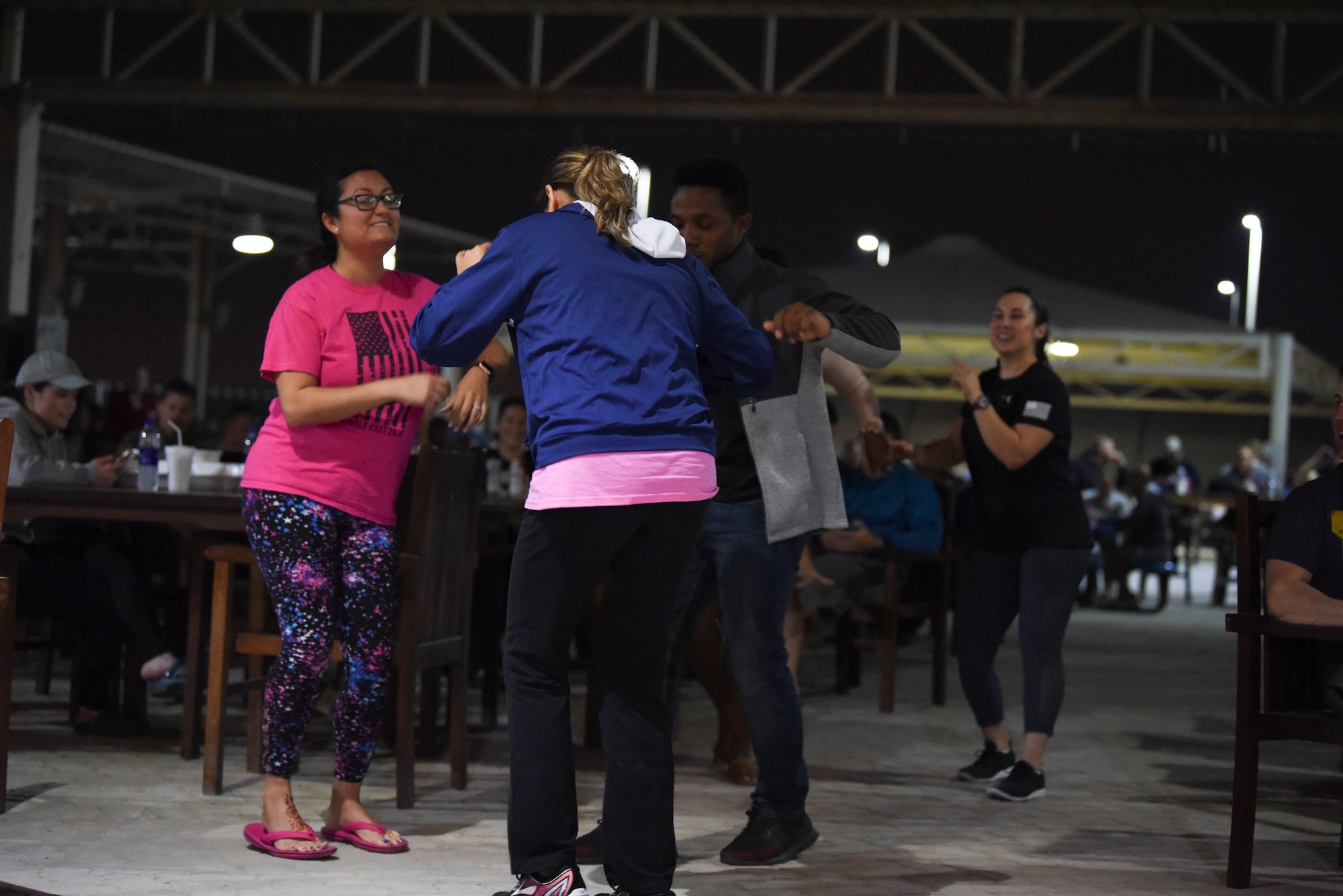 Members dance during the Air Forces Central Command band’s performance at Al Dhafra Air Base, United Arab Emirates, Mar. 20, 2019.