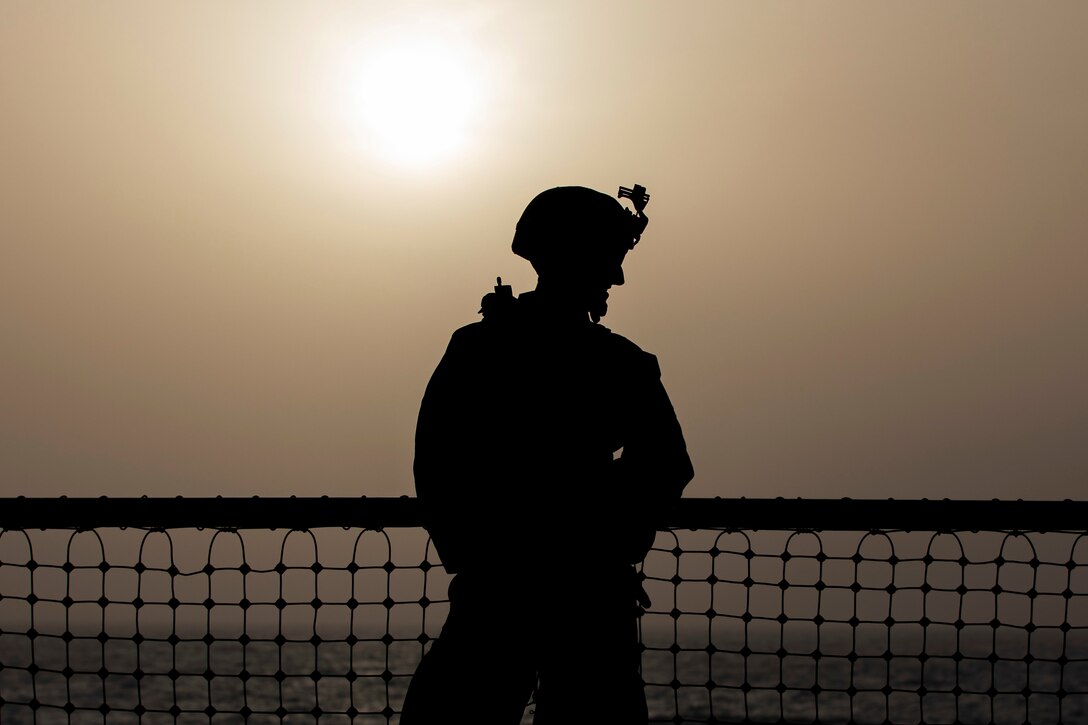 U.S. Marine Cpl. Kyle Fogarty, an anti-tank missileman with the 22nd Marine Expeditionary Unit, stands watch on the flight deck of the Whidbey Island-class dock landing ship USS Fort McHenry. The Marines and Sailors aboard stood watch while the Fort McHenry dropped anchor for routine maintenance. Marines and Sailors with the 22nd MEU and Kearsarge Amphibious Ready Group are currently deployed to the U.S. 5th Fleet area of operations in support of naval operations to ensure maritime stability and security in the Central Region, connecting the Mediterranean and the Pacific through the western Indian Ocean and three strategic choke points.