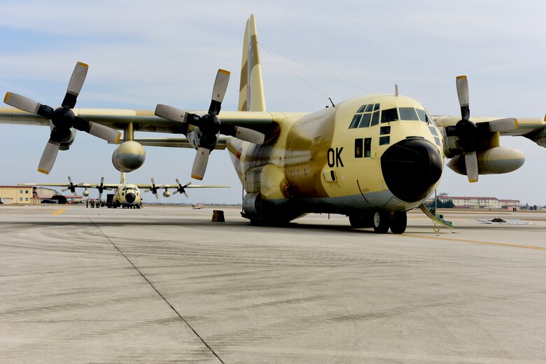 U.S. Airmen from the 724th Air Mobility Squadron load equipment onto a Royal Moroccan Air Force C-130H Hercules at Aviano Air Base, Italy