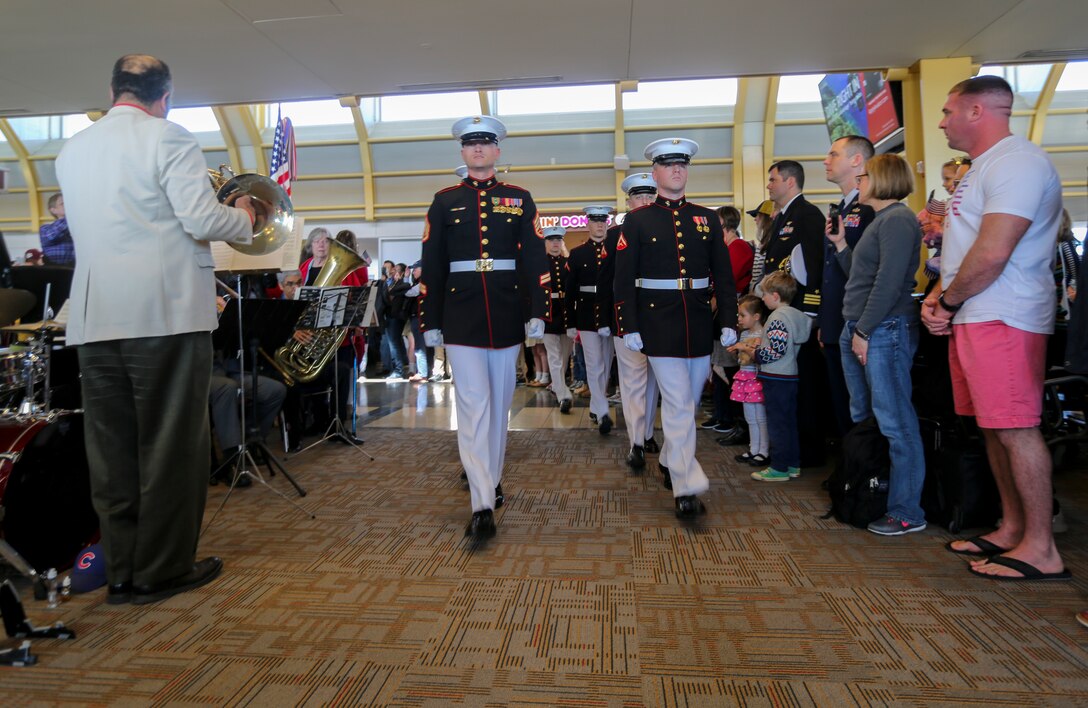 Marines with Alpha Company, Marine Barracks Washington D.C., support the annual Medal of Honor (MoH), Honor Flight at Ronald Reagan National Airport, Washington, D.C., March 23, 2019. The 30 MoH recipients were welcomed by the Marines upon their arrival, among a military band, numerous volunteers, and people eager to shake their hands. The honor flight aims to pay tribute to those who served their country during times of war and received our nation’s highest and most prestigious personal military decoration; the Medal of Honor. (U.S. Marine Corps photo by Sgt. Robert Knapp/Released)