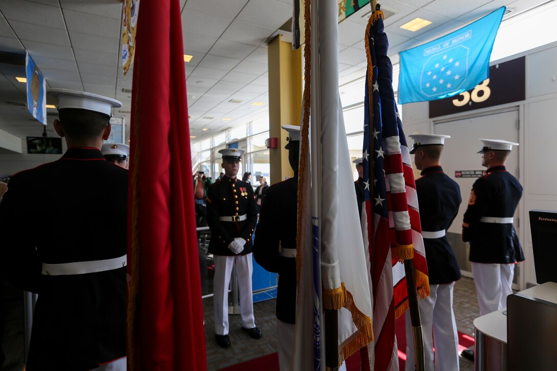 Marines with Alpha Company, Marine Barracks Washington D.C., support the annual Medal of Honor (MoH), Honor Flight at Ronald Reagan National Airport, Washington, D.C., March 23, 2019. The 30 MoH recipients were welcomed by the Marines upon their arrival, among a military band, numerous volunteers, and people eager to shake their hands. The honor flight aims to pay tribute to those who served their country during times of war and received our nation’s highest and most prestigious personal military decoration; the Medal of Honor. (U.S. Marine Corps photo by Sgt. Robert Knapp/Released)