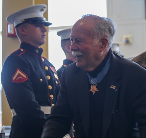 Retired Marine Col. Harvey C. Barnum, Medal of Honor recipient, greets guests during the annual Medal of Honor (MoH), Honor Flight at Ronald Reagan National Airport, Washington, D.C., March 23, 2019.
