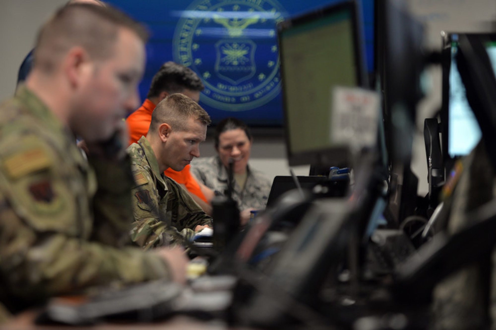 Master Sgt. Luke Nelson, 55th Force Support Squadron superintendent, acts as the first-source of flood information for the 55th FSS from the Recovery Operations Center March 19, 2019. The 55th Wing experienced record flooding as a result of unprecedented snowfall coupled with a dam in the northern part of the sate that failed. (U.S. Air Force photo by Josh Plueger)