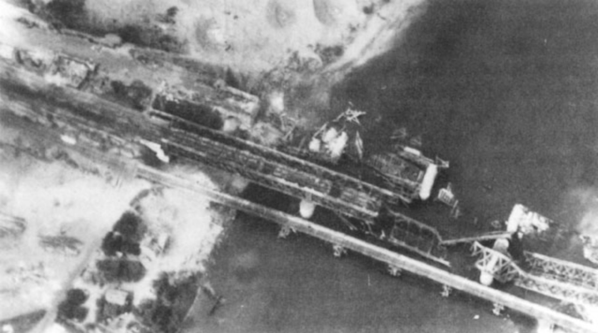 An Allied attack on the bridge over the Seine River at Oissell, France, on May 9, 1945, made the bridge unusable. German forces could not repair the Seine bridges fast enough to keep up with their damage/destruction in spring 1944. (USAAF archival photo)