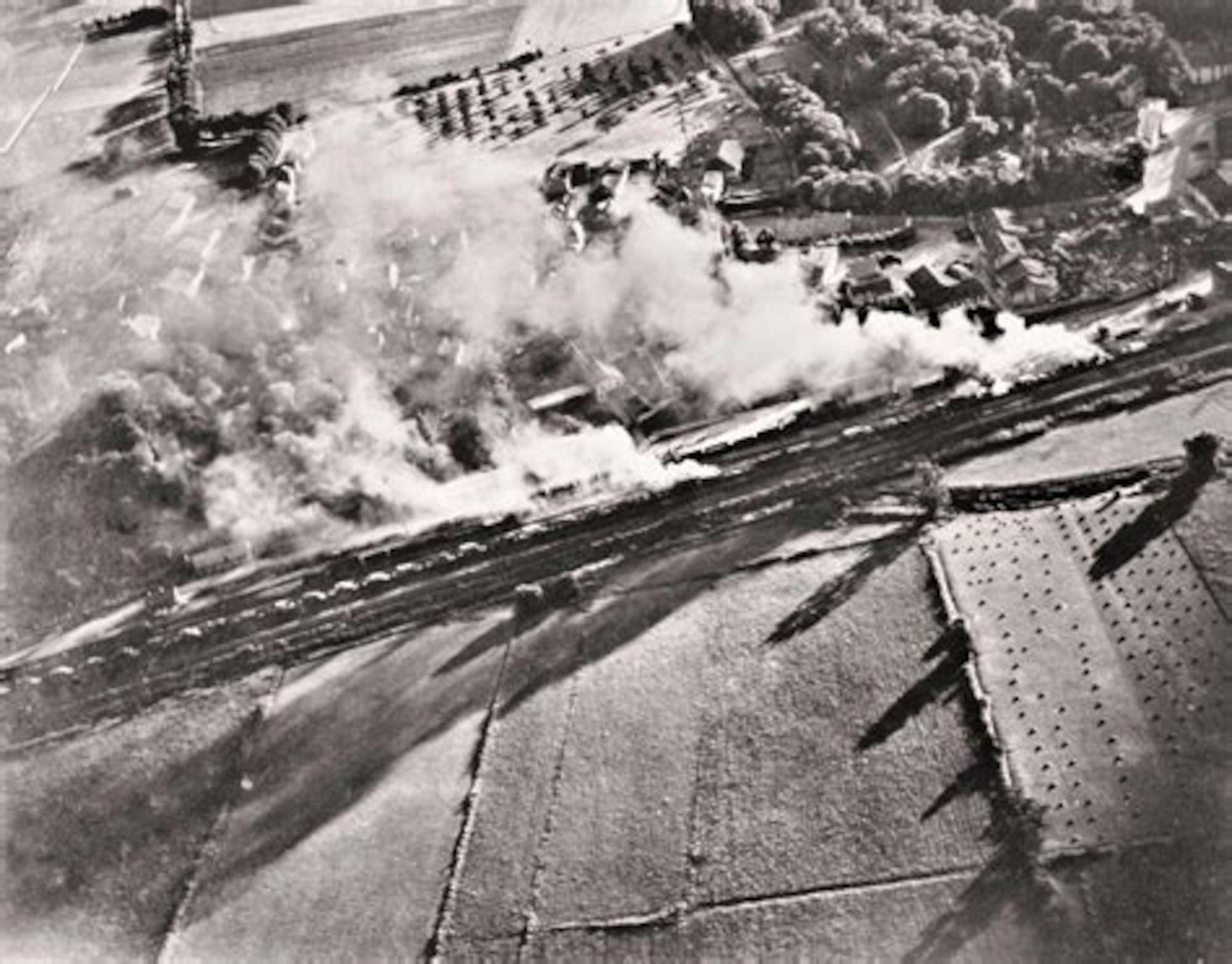 A photograph, taken by the gun camera of a P-47 Thunderbolt, showing the aircraft strafing a French freight train. The Republic P-47 Thunderbolt was one of the primary tactical aircraft used by the U.S Army. Air Forces for attacks on railyards, freight trains and military airfields during the implementation of the Transportation Plan. (USAAF archival photo)