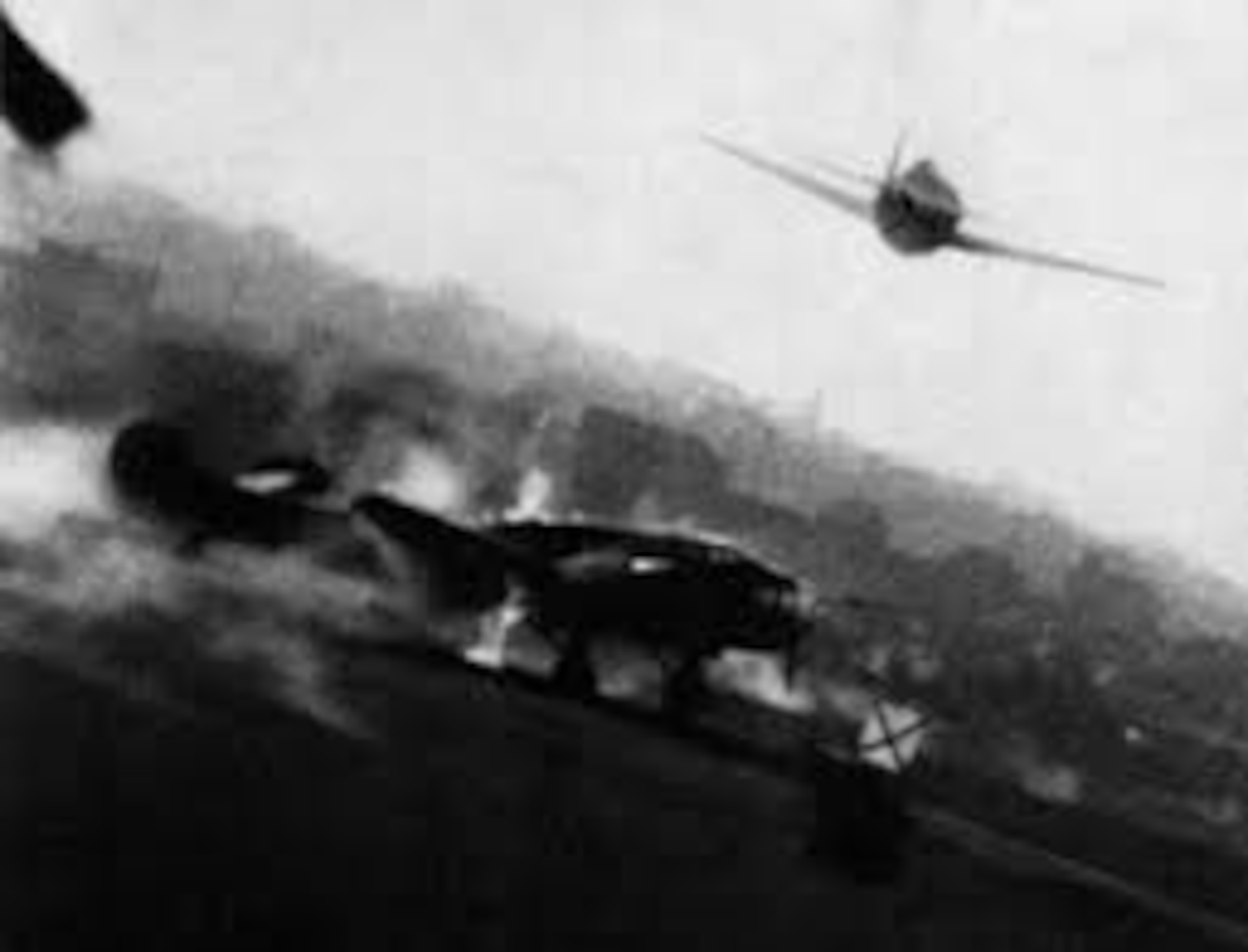 A photograph, taken by the gun camera of a P-47 Thunderbolt, of an American strafing attack on a German airfield in France. In addition to attacks on transportation targets, Allied aircraft attacked German airfields in France and Belgium. These attacks, combined with the intensifying strategic bombing of industrial targets and cities in Germany, forced the Luftwaffe to withdraw most of their fighters from Western Europe back to Germany. (USAAF archival photo)