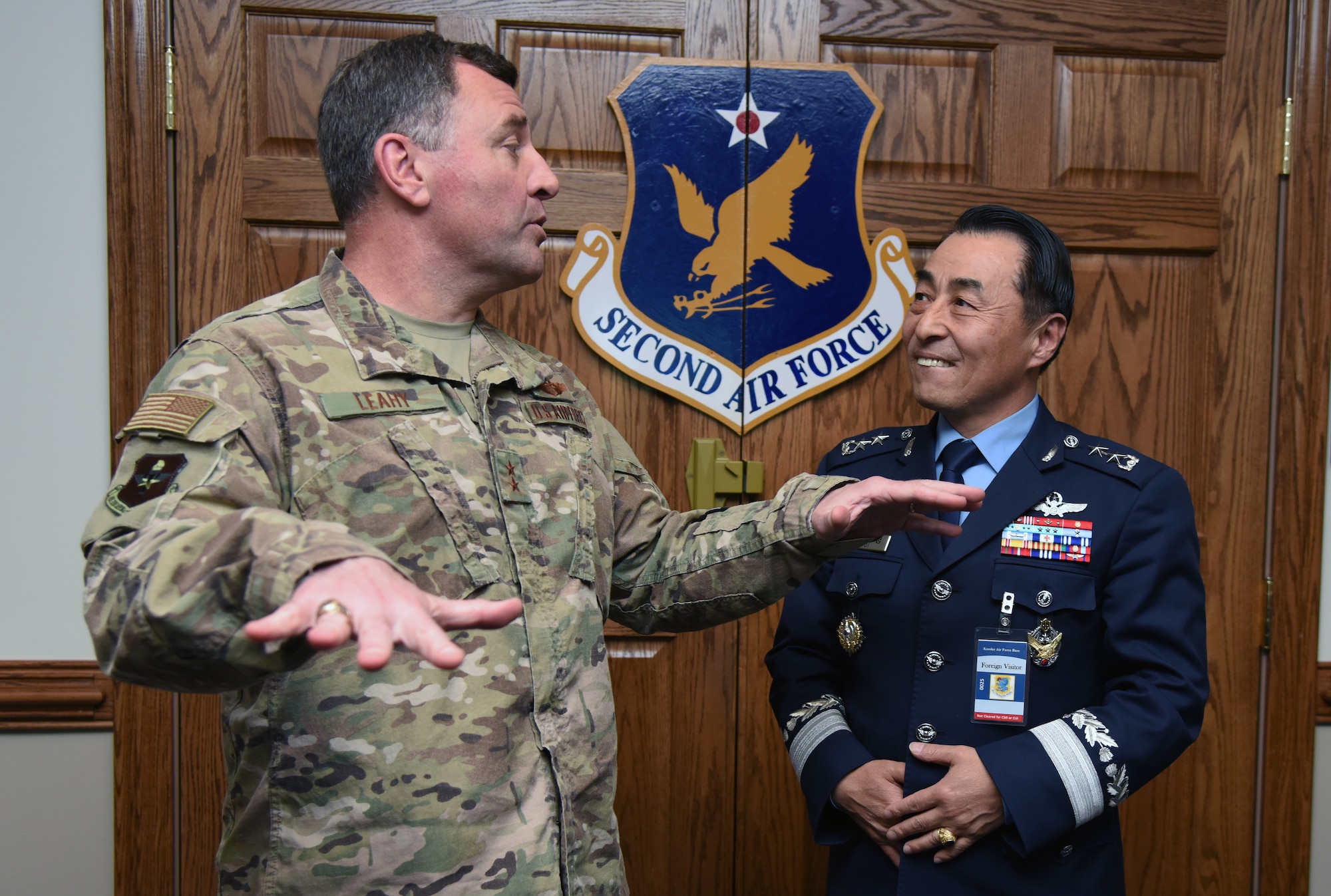 U.S. Air Force Maj. Gen. Timothy Leahy, Second Air Force commander, speaks with Republic of Korea Air Force Maj. Gen. Geunyoung Choi, ROKAF Air Education and Training Command commander, following a 2nd AF mission brief at the headquarters building on Keesler Air Force Base, Mississippi, March 22, 2019. Choi visited Keesler to help better develop ROKAF technical education through visiting U.S. Air Force future technology education sites.  (U.S. Air Force photo by Kemberly Groue)