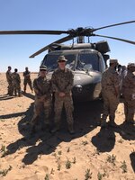 Spc. Stephanie Gonzalez-Rodriguez and Spc. Jonathan Saffle, Special Troops Battalion medics, 300th Sustainment Brigade, pause for a picture during Desert Leopard Medical Training at Task Force Sabah Aid Station, Kuwait, March 3, 2019. (U.S. Army Reserve photo by Spc. Samantha Moore)