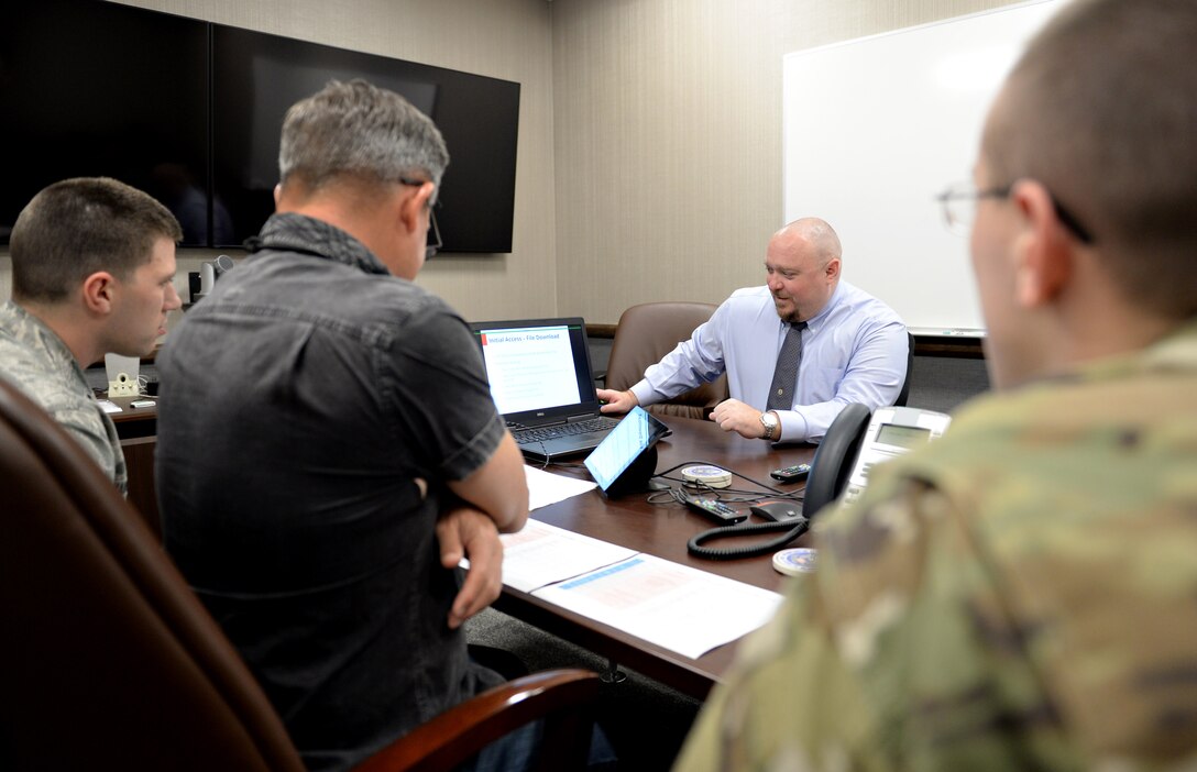 Members of the 92nd Cyberspace Operations Squadron brief 567th Cyberspace Operations Group “hunt exercise” judges on their findings during the exercise at Joint Base San Antonio-Lackland, Texas, March 22, 2019. The three-day exercise afforded teams from the 90th, 92nd, 833rd and 834th COSs, as well as the Air Force Office of Special Investigations, the opportunity to defend against an enemy within a virtual training network. (U.S. Air Force photo by Tech. Sgt. R.J. Biermann)