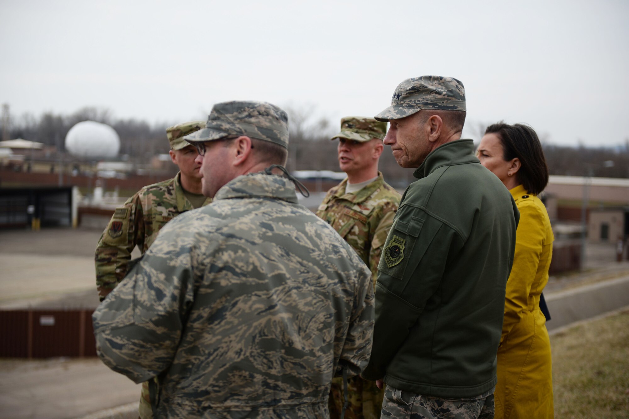 U.S. Air Force Gen. Mike Holmes, commander of Air Combat Command, looks over the damage caused by flooding during his visit March 25, 2019, to Offutt Air Force Base, Nebraska. He stopped by the base to get an up-close assessment and to thank those who worked to fortify the base before the water hit and those who are supporting its recovery efforts. (Photo by Tech. Sgt. Rachelle Blake)