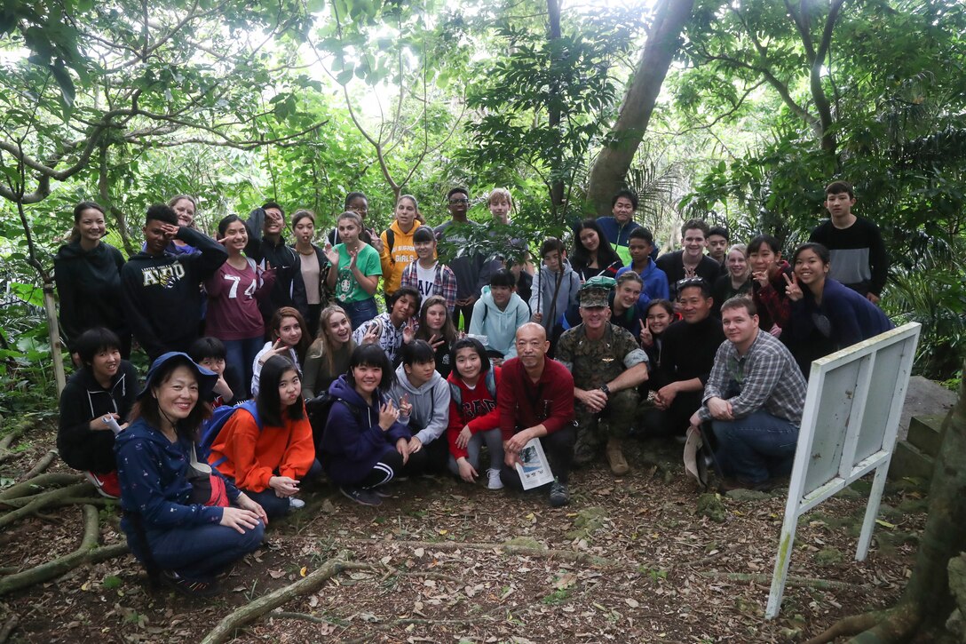 Students from Camp Lester Middle School interact with students from Chatan Junior High School at Chatan Castle on Camp Smedley D. Butler, Okinawa, Japan, March 21, 2019. The students were participating in a culture exchange, held to promote a better relationship with the local community. (U.S. Marine Corps photo by Lance Cpl. Savannah Mesimer)