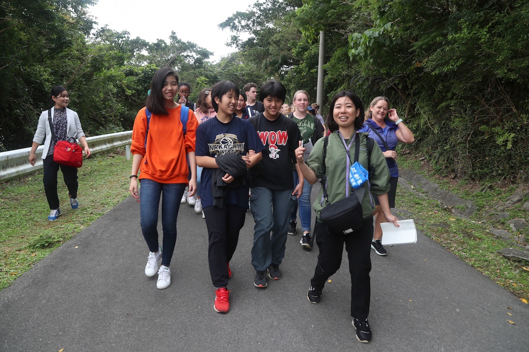 Students from Camp Lester Middle School interact with students from Chatan Junior High School at Chatan Castle on Camp Smedley D. Butler, Okinawa, Japan, March 21, 2019. The students were participating in a culture exchange, held to promote a better relationship with the local community. (U.S. Marine Corps photo by Lance Cpl. Savannah Mesimer)