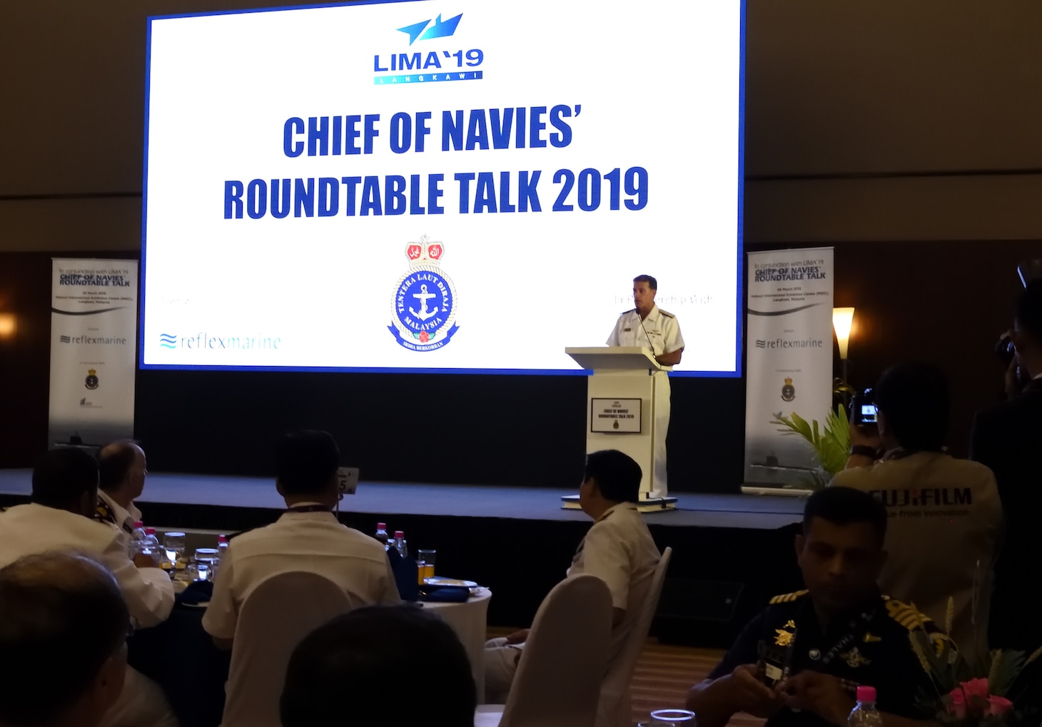 LANGKAWI, Malaysia (March 26, 2019)  Commander, U.S. Pacific Fleet, Adm. John Aquilino speaks to key naval and air leaders from around the Indo-Pacific during the Chief of Navies' Roundtable Talks at the 2019 Langkawi International Maritime and Aerospace (LIMA) Exhibition. Approximately 1,400 U.S. Navy and Air Force personnel participated in LIMA19. U.S. Navy aircraft on display included a P-8A Poseidon, EA-18G Growler, and MH-60R Seahawk. The 7th Fleet flagship, USS Blue Ridge (LCC 19), and destroyer, USS Preble (DDG 88), arrived Mar. 25