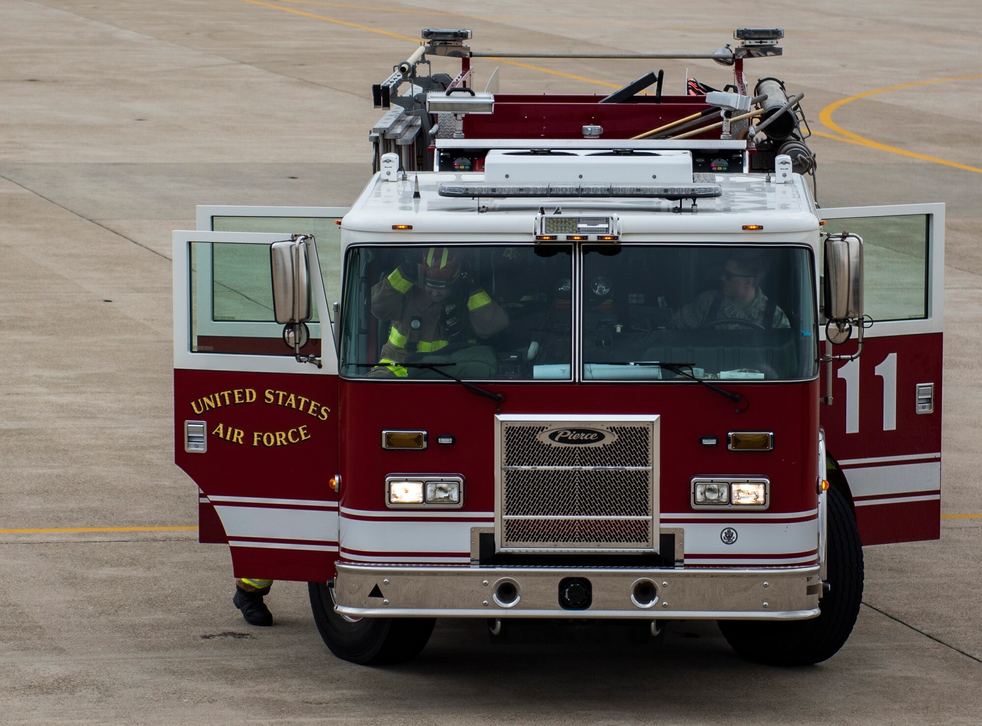 Fire fighters from the 8th Civil Engineer Squadron disembark their fire truck at Kunsan Air Base, Republic of Korea, March 26, 2019. Fire fighters have six minutes to respond to a fall victim being suspended by their safety harness before the situation can become life-threatening. (U.S. Air Force phot by Senior Airman Stefan Alvarez)