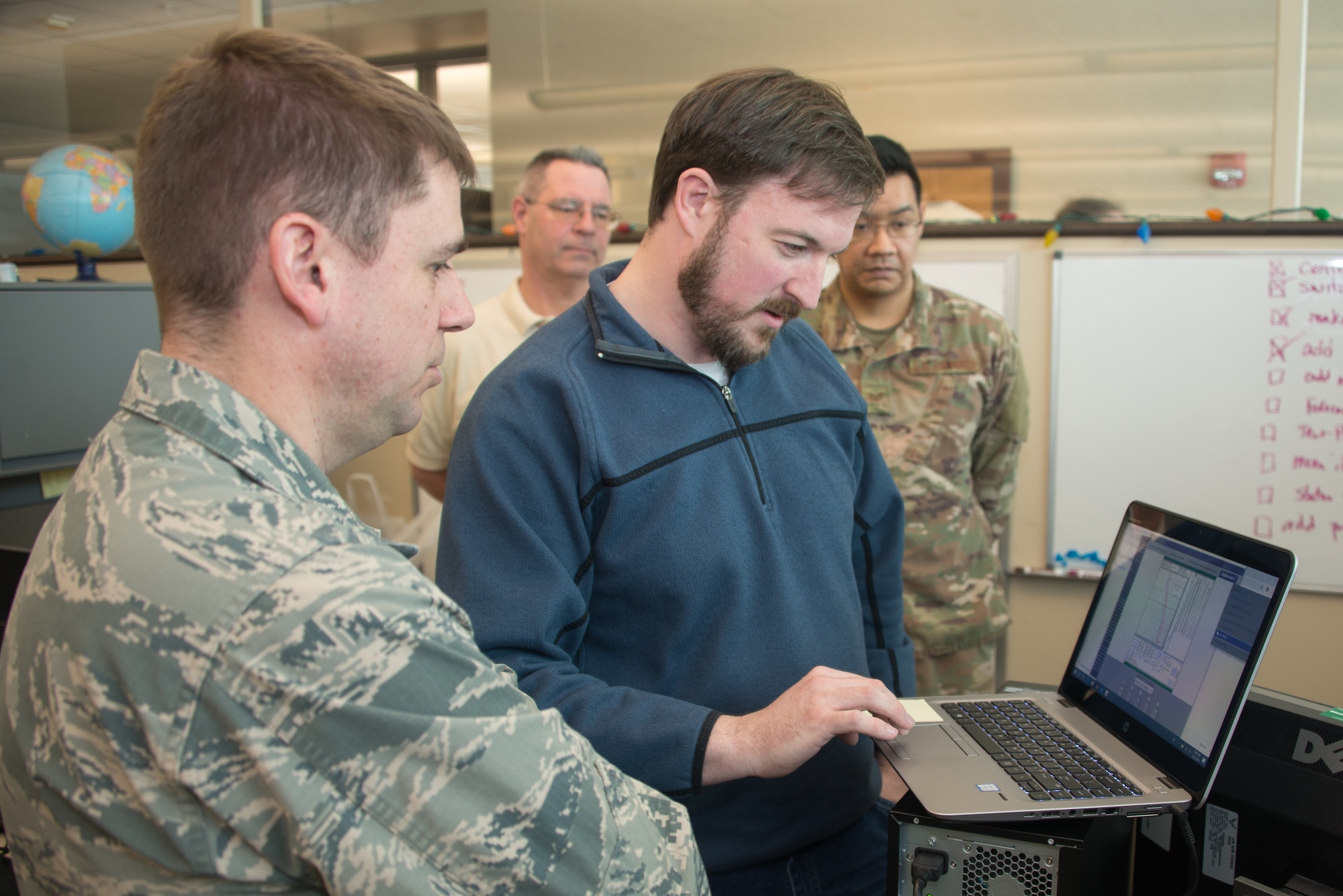 Airmen from the 16th Weather Squadron test software written as part of Exercise Adaptive Lightning 19, Task Force Bat Phone, at Offutt Air Force Base, Nebraska, Feb. 26, 2019. Task Force Bat Phone is a 2nd Weather Group project that uses off-the-shelf technology combined with rapid development techniques to deliver new communication capabilities to deployed forecasters in contested, degraded or operationally-limited environments. (U.S. Air Force photo by Paul Shirk)