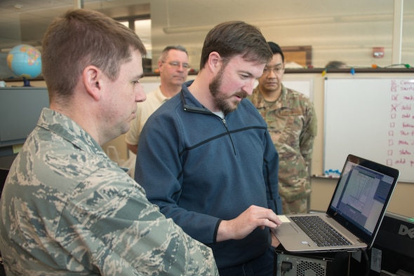 Airmen from the 16th Weather Squadron test software written as part of Exercise Adaptive Lightning 19, Task Force Bat Phone, at Offutt Air Force Base, Nebraska, Feb. 26, 2019. Task Force Bat Phone is a 2nd Weather Group project that uses off-the-shelf technology combined with rapid development techniques to deliver new communication capabilities to deployed forecasters in contested, degraded or operationally-limited environments. (U.S. Air Force photo by Paul Shirk)
