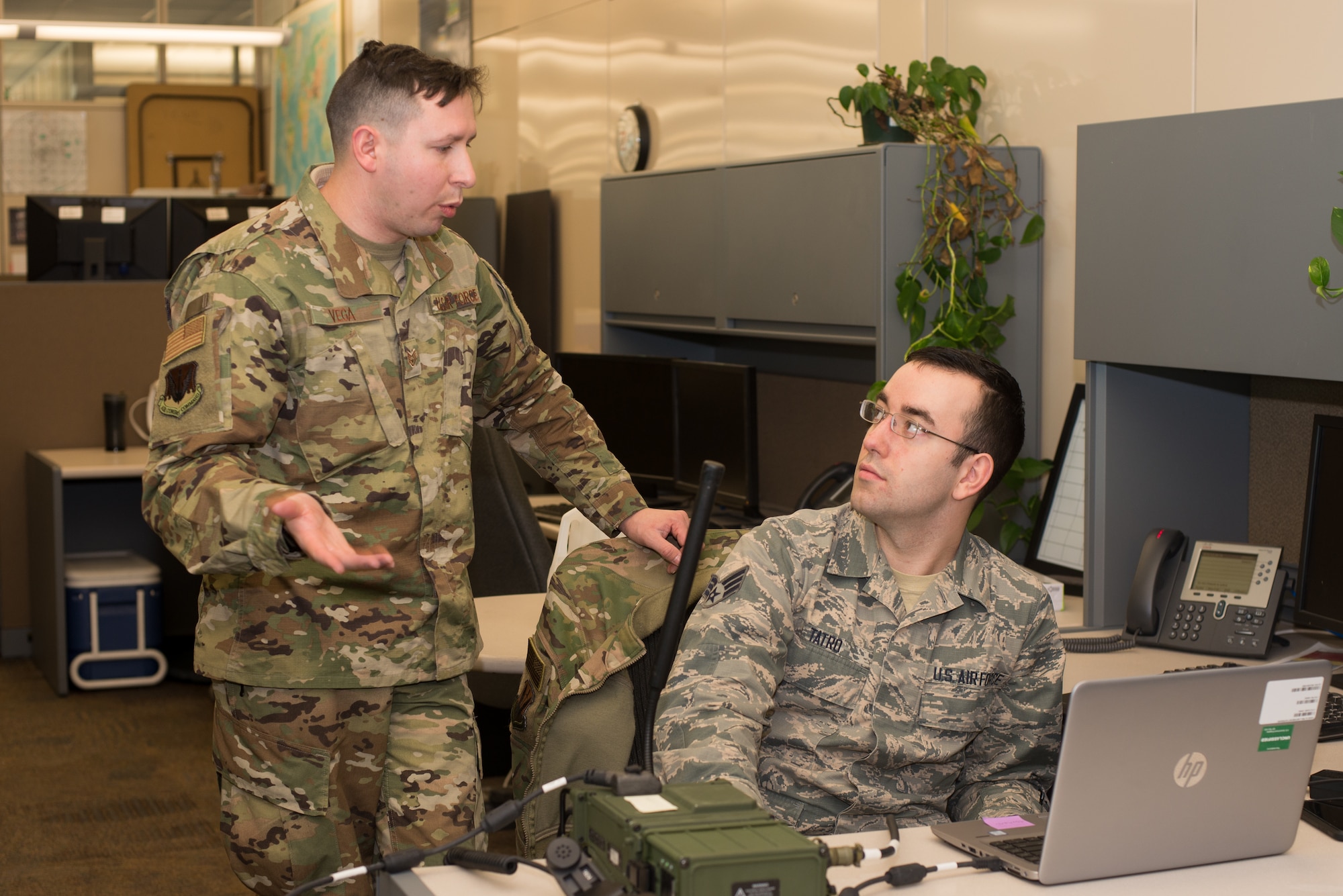 Staff Sgt. Victor Vega, 2nd Combat Weather Systems Squadron weather systems trainer, and Senior Airman Erik Tatro, 2nd Systems Operations Squadron alphanumerics collection technician, prepare for a test of the Exercise Adaptive Lightning 19, Task Force Bat Phone, at Offutt Air Force Base, Nebraska, Feb. 26, 2019. Using agile development techniques, the development team was able to successfully write and test a proof of concept in only seven weeks. (U.S. Air Force photo by Paul Shirk)