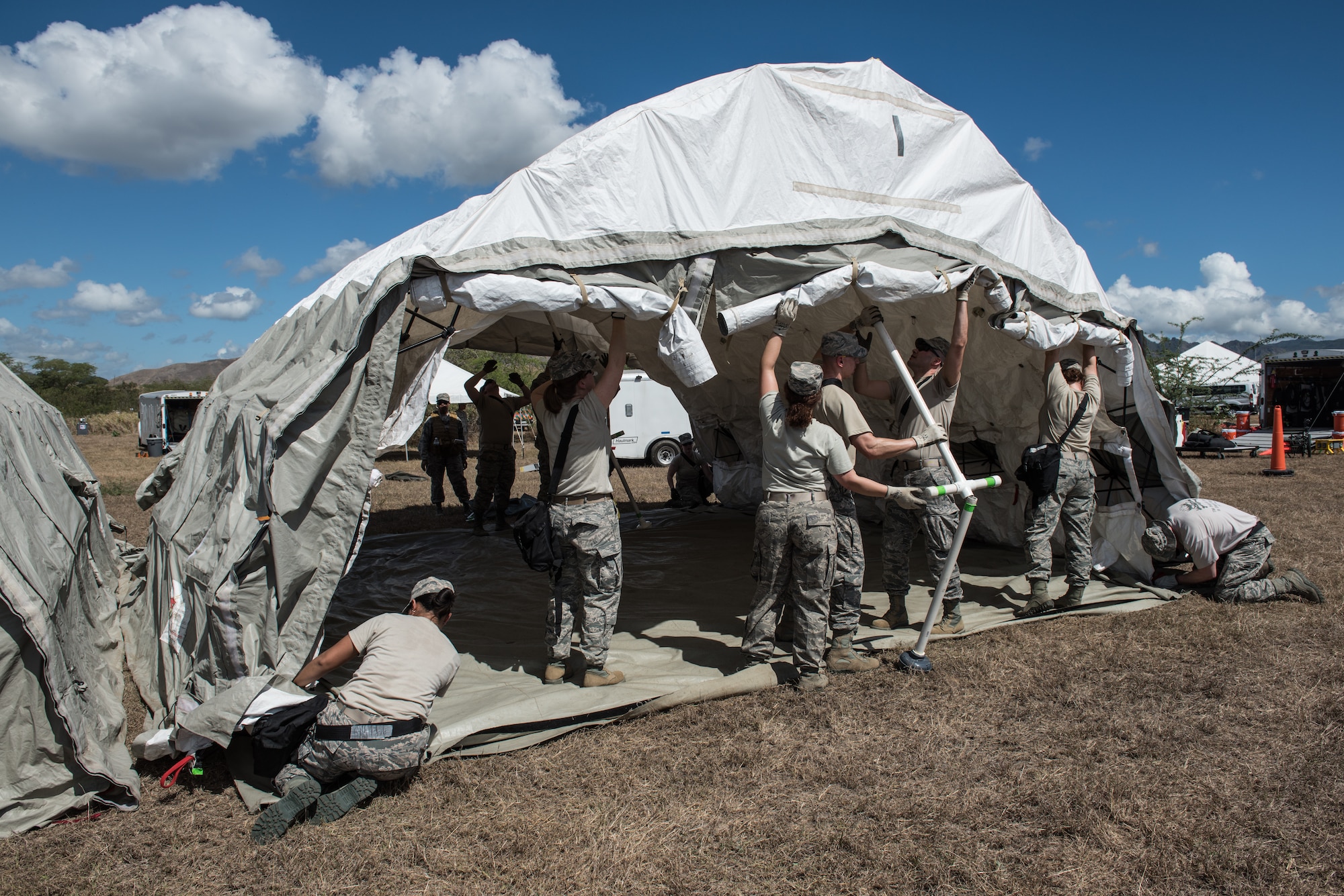 U.S. Airmen from the 193rd Special Operations Medical Group Detachment 1, Pennsylvania Air National Guard, set up a tent during Vigilant Guard.