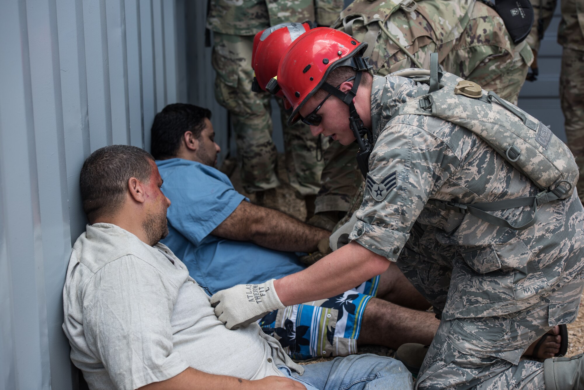 U.S. Air Force Senior Airman Caedan Sweeney, a search and extraction medic with the 193rd Special Operations Medical Group Detachment 1, Pennsylvania Air National Guard, evaluates a casualty actor during exercise Vigilant Guard.