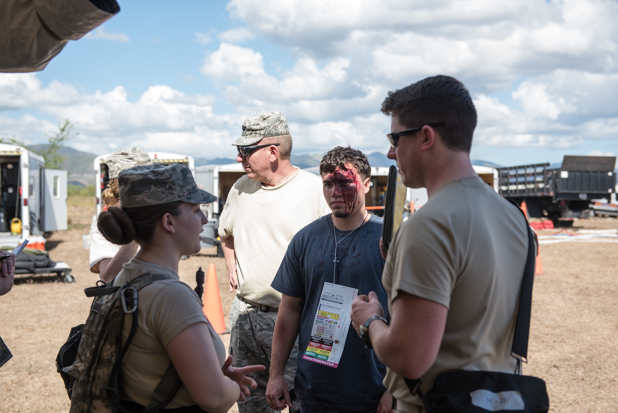 U.S. Airmen with the 193rd Special Operations Medical Group Detachment 1, Pennsylvania Air National Guard, discuss the treatment of casualty actor during exercise Vigilant Guard