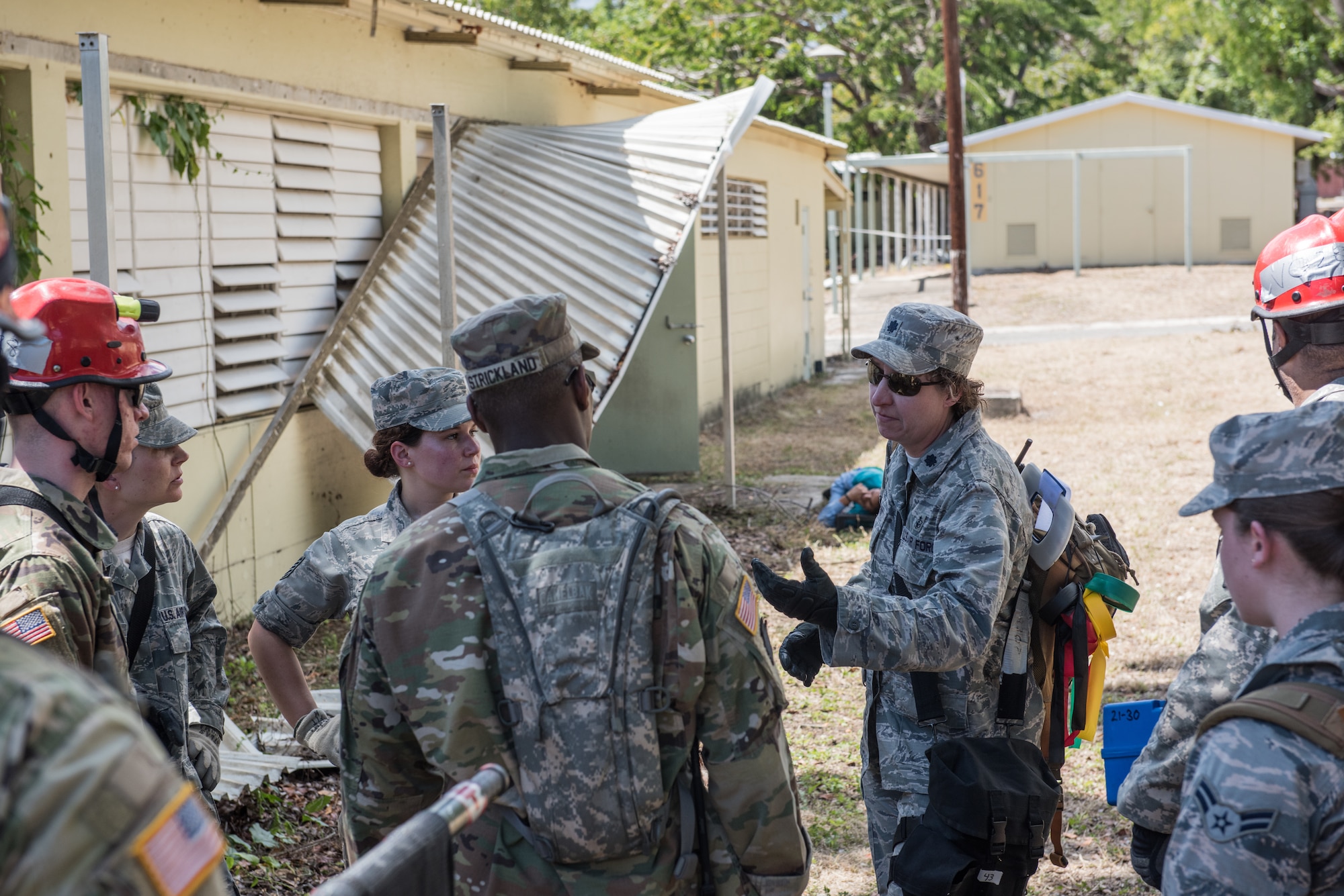 U.S. Airmen and Soldiers from the 3rd Chemical, Biological, Radiological, Nuclear Task Force, Pennsylvania National Guard, discuss aspects of their training scenario during the exercise Vigilant Guard.