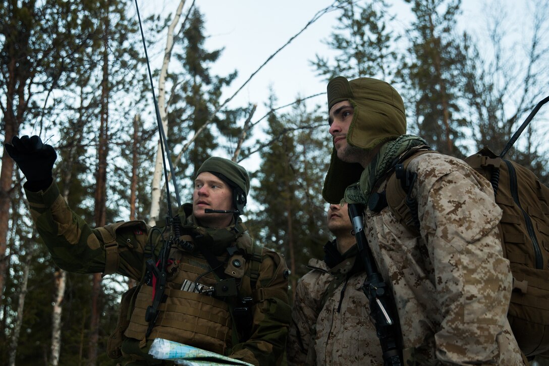 U.S. Marines with Marine Rotational Force-Europe 19.1, Marine Forces Europe and Africa, plan a defensive operation with a Norwegian army soldier during Exercise Northern Wind 19 in northern Sweden, March 22, 2019. This exercise focuses on enhancing Marines’ proficiency with cold-weather equipment while enhancing basic winter-warfare skills in cold-weather environments. (U.S. Marine Corps photo by Cpl. Nghia Tran)